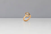 Todd Reed engagement ring in 18 karat rose gold, set with a natural grey diamond(2.87cts), and white brilliant cut diamonds(.10cts)
